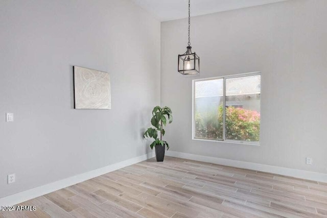 spare room with light wood-type flooring