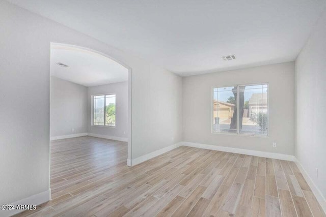 spare room with light wood-type flooring