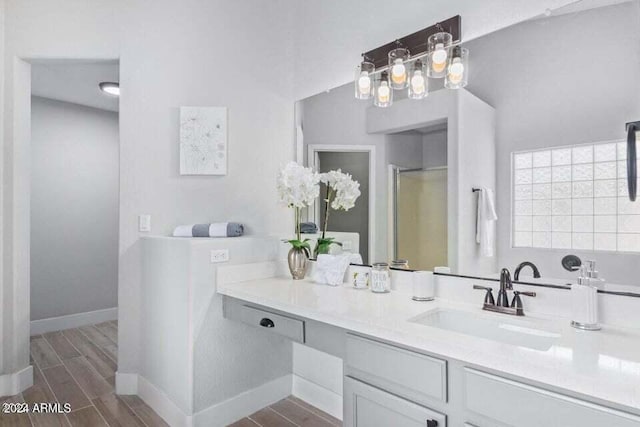 bathroom featuring hardwood / wood-style floors and vanity