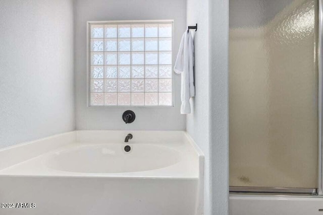 bathroom with independent shower and bath