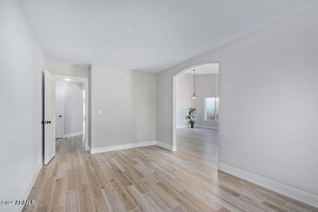 unfurnished room featuring light hardwood / wood-style flooring