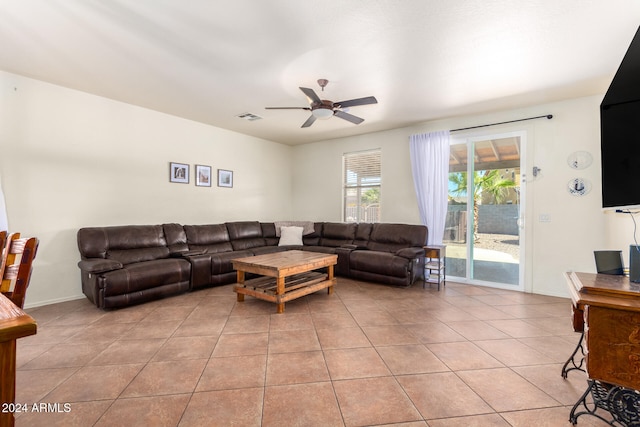 tiled living room featuring ceiling fan