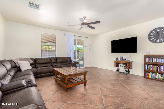 tiled living room featuring ceiling fan