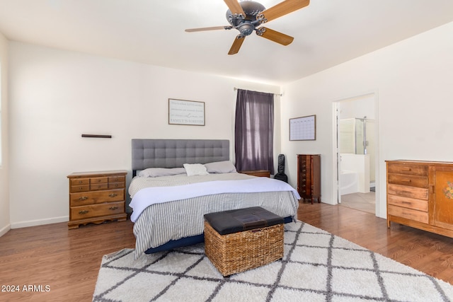 bedroom with ensuite bath, ceiling fan, and wood-type flooring