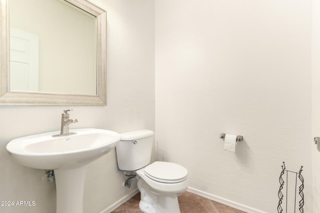 bathroom with tile patterned floors and toilet