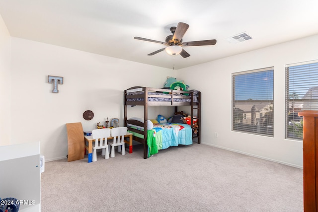 bedroom featuring ceiling fan and light carpet