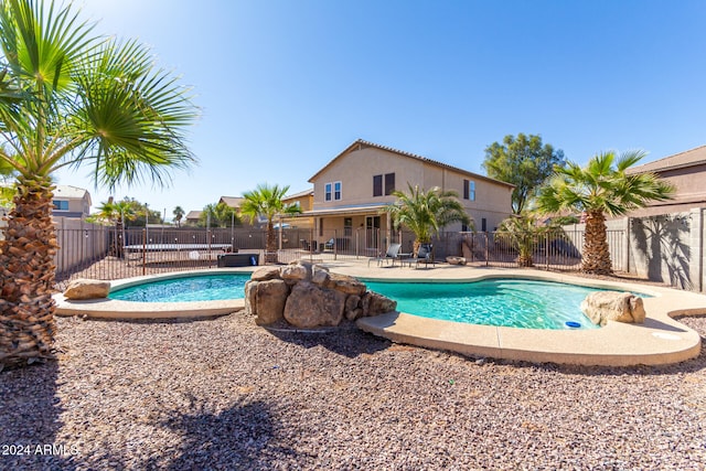 view of swimming pool with a patio