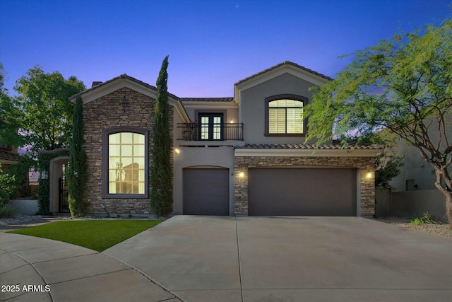 view of front of home featuring a balcony and a garage