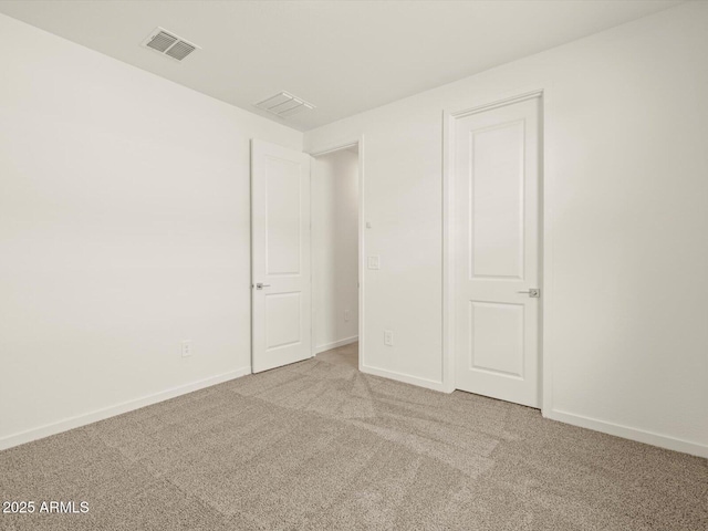 unfurnished bedroom with carpet and baseboards