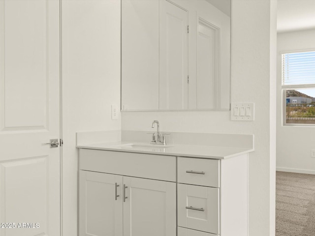 bathroom featuring vanity and baseboards