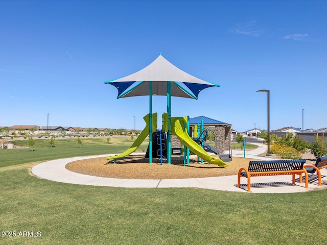 community jungle gym with a lawn