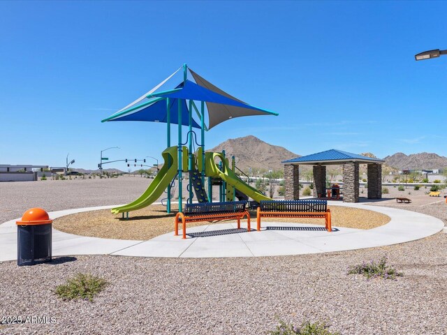 community jungle gym with a mountain view