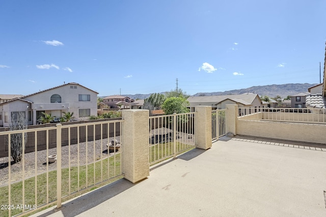 exterior space featuring a fenced backyard and a residential view