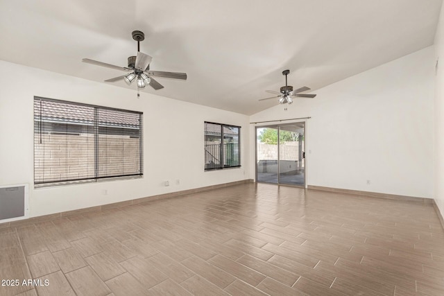 spare room featuring vaulted ceiling and ceiling fan