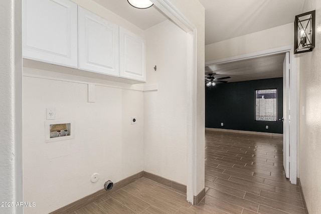 clothes washing area featuring cabinets, ceiling fan, electric dryer hookup, and hookup for a gas dryer