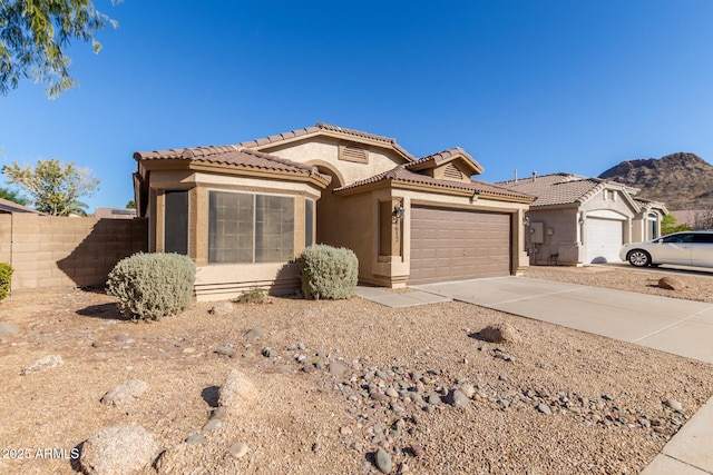 view of front of house with a garage and a mountain view