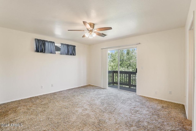 empty room featuring carpet and ceiling fan