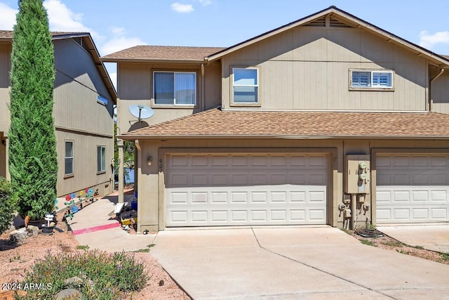 front of property with a garage