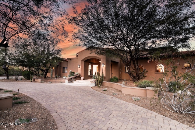 14760 E Paradise Dr, Fountain Hills, AZ 85268 - view of front facade featuring stucco siding and curved driveway