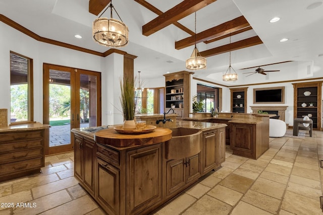 14760 E Paradise Dr, Fountain Hills, AZ 85268 - kitchen with a sink, stone tile flooring, a kitchen island with sink, recessed lighting, and open floor plan