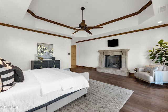14760 E Paradise Dr, Fountain Hills, AZ 85268 - bedroom featuring wood finished floors, crown molding, a tray ceiling, a premium fireplace, and baseboards