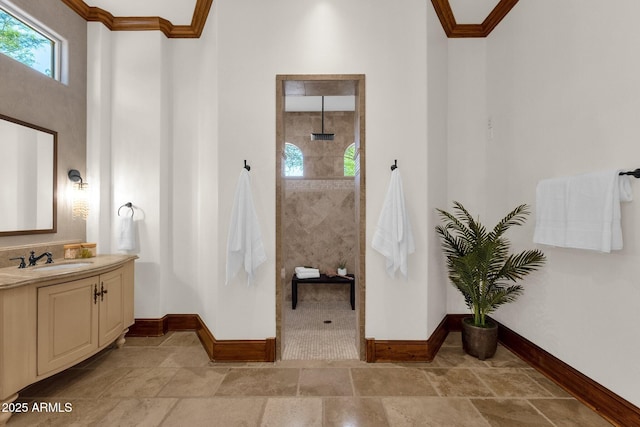 14760 E Paradise Dr, Fountain Hills, AZ 85268 - bathroom with baseboards, vanity, walk in shower, stone tile floors, and crown molding