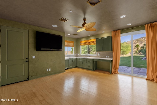 14760 E Paradise Dr, Fountain Hills, AZ 85268 - kitchen with green cabinets, light countertops, a ceiling fan, light wood finished floors, and recessed lighting