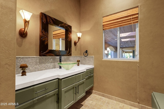14760 E Paradise Dr, Fountain Hills, AZ 85268 - bathroom featuring vanity, a textured wall, and decorative backsplash