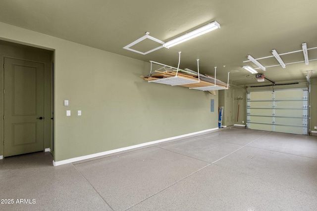 14760 E Paradise Dr, Fountain Hills, AZ 85268 - garage featuring baseboards and a garage door opener