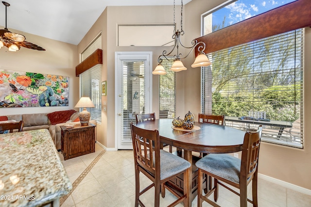 tiled dining room featuring ceiling fan