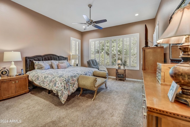 bedroom featuring light carpet and ceiling fan