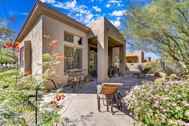 back of house with a patio area