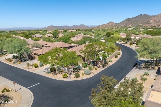 birds eye view of property with a mountain view