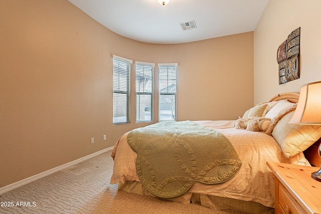 bedroom with light carpet, baseboards, and visible vents