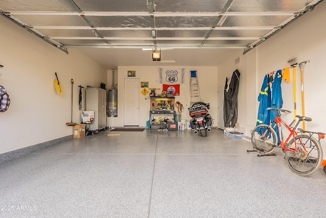 garage with a garage door opener, gas water heater, and baseboards