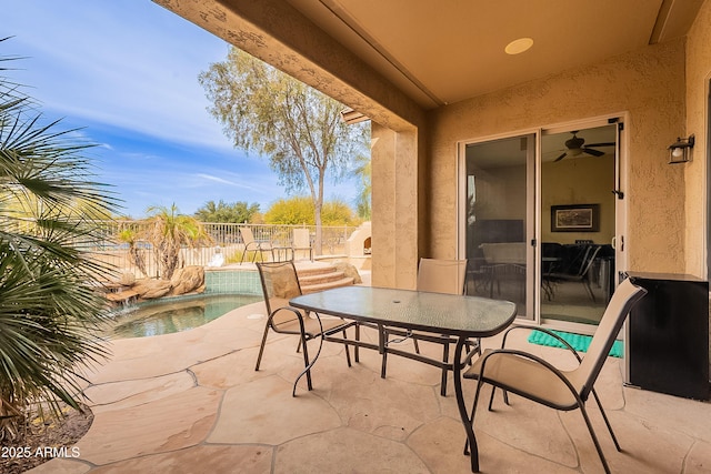 view of patio / terrace featuring a fenced backyard, a fenced in pool, and outdoor dining space