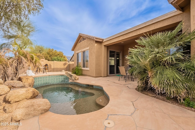 view of swimming pool featuring a patio area, a fenced backyard, and a fenced in pool