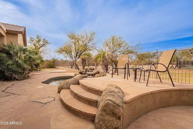 view of home's community featuring a fenced backyard and a patio