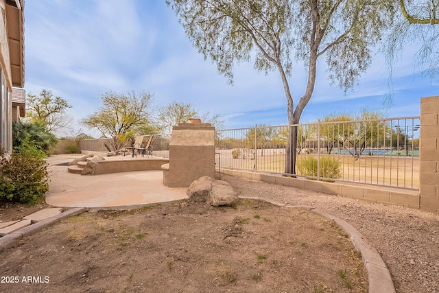 surrounding community featuring a patio area and fence