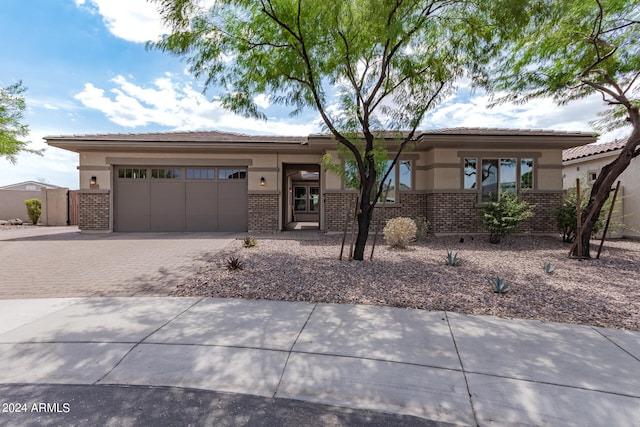 prairie-style home featuring a garage