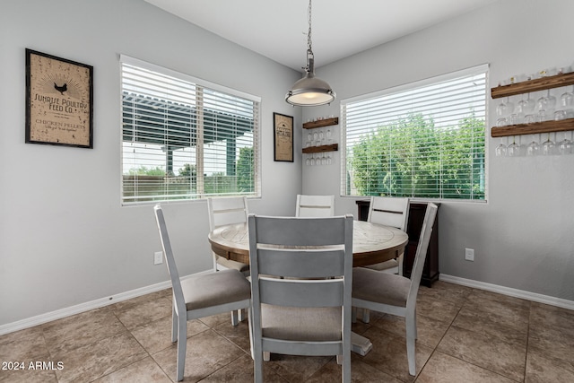 dining space featuring tile patterned flooring