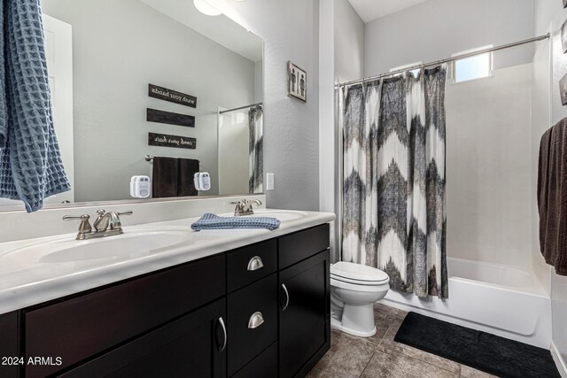 full bathroom featuring tile patterned flooring, toilet, vanity, and shower / bath combo