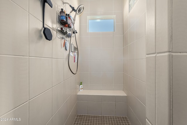 bathroom with a tile shower