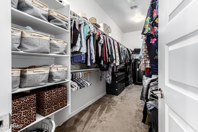 spacious closet featuring carpet flooring