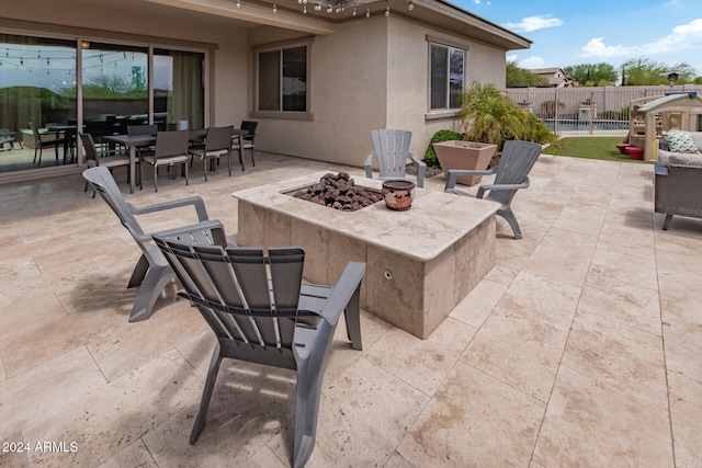 view of patio with an outdoor fire pit