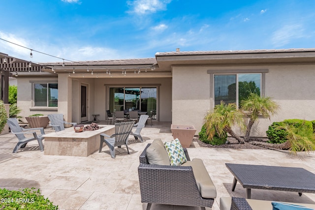 exterior space with an outdoor fire pit