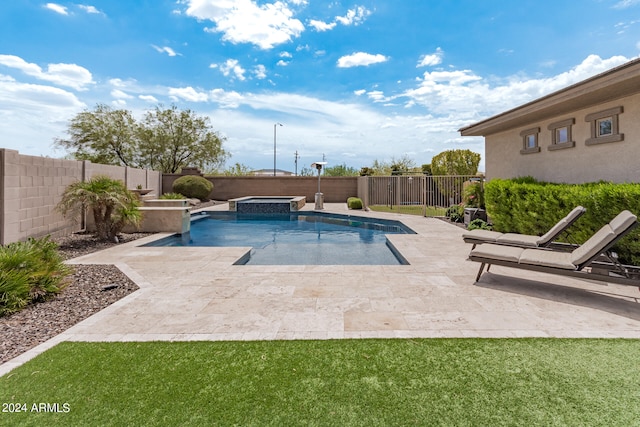 view of pool featuring a patio area and an in ground hot tub