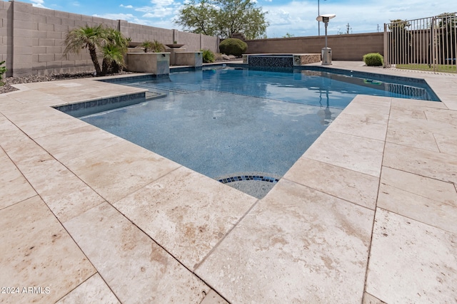 view of pool featuring a patio and pool water feature