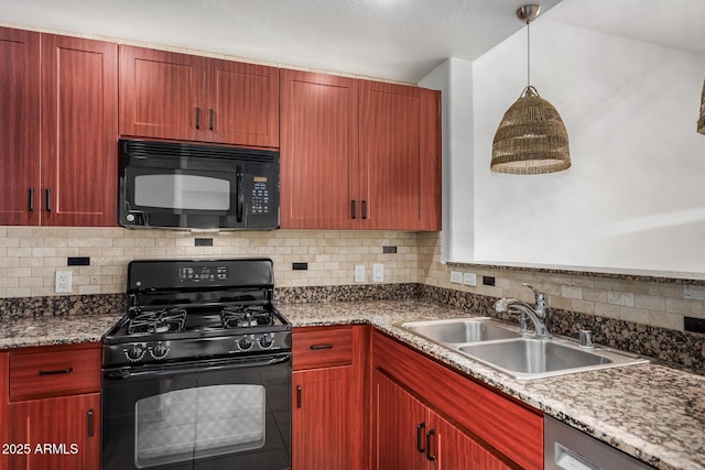 2302 N Central Ave Unit 206, Phoenix, AZ 85004 - kitchen with black appliances, a sink, tasteful backsplash, hanging light fixtures, and dark brown cabinets