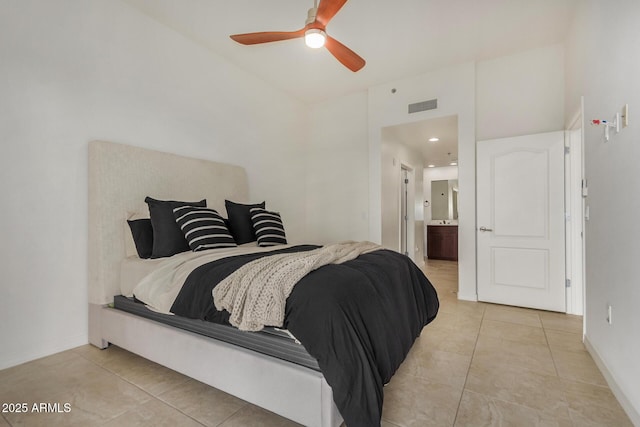 2302 N Central Ave Unit 206, Phoenix, AZ 85004 - bedroom with light tile patterned floors, connected bathroom, baseboards, and ceiling fan